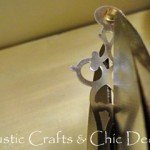 Cutting of clock hands, with tin snips, to a smaller size.