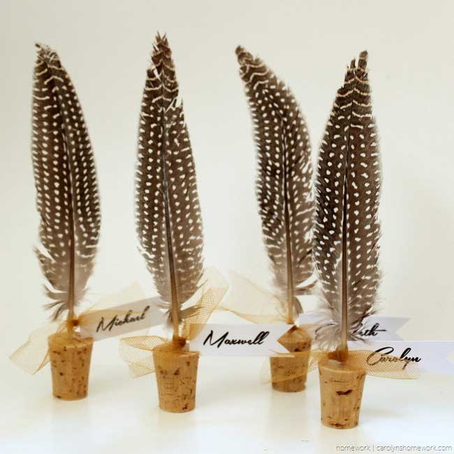 diy place card holders with feathers and corks