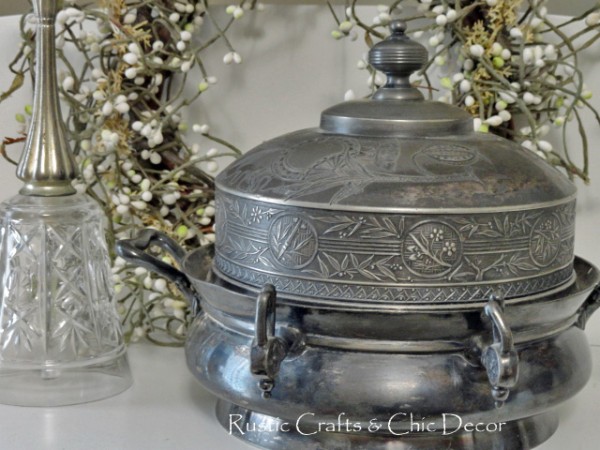 silver serving dish in front of white peaberry wreath