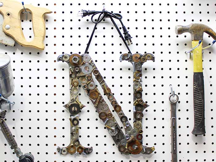 monogram letter made with old nuts and bolts