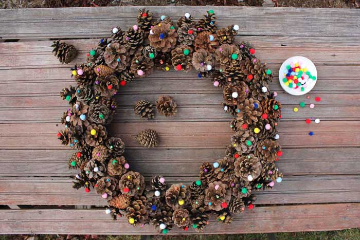 pine cone crafts wreath with pom poms