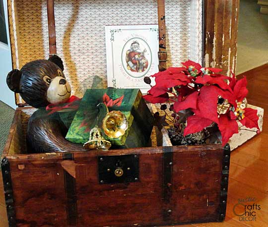 Christmas decor displayed in a vintage trunk