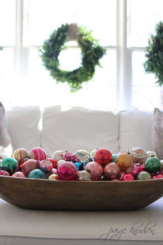 wooden bowl filled with Christmas ornaments