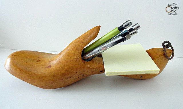 vintage wooden shoe mold as a holder for paper and pens