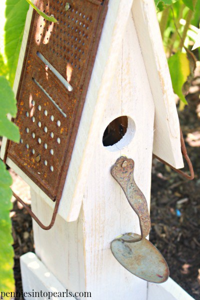 birdhouse made from pallet wood, a rusty grate and a spoon