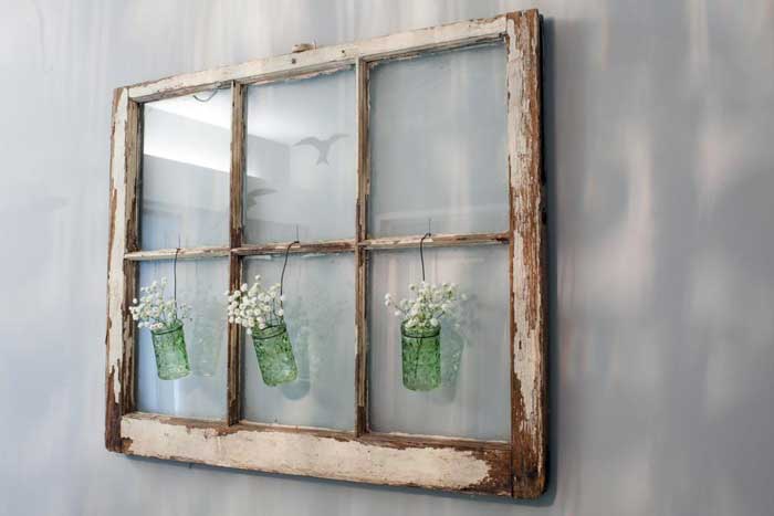 old window with hanging vases