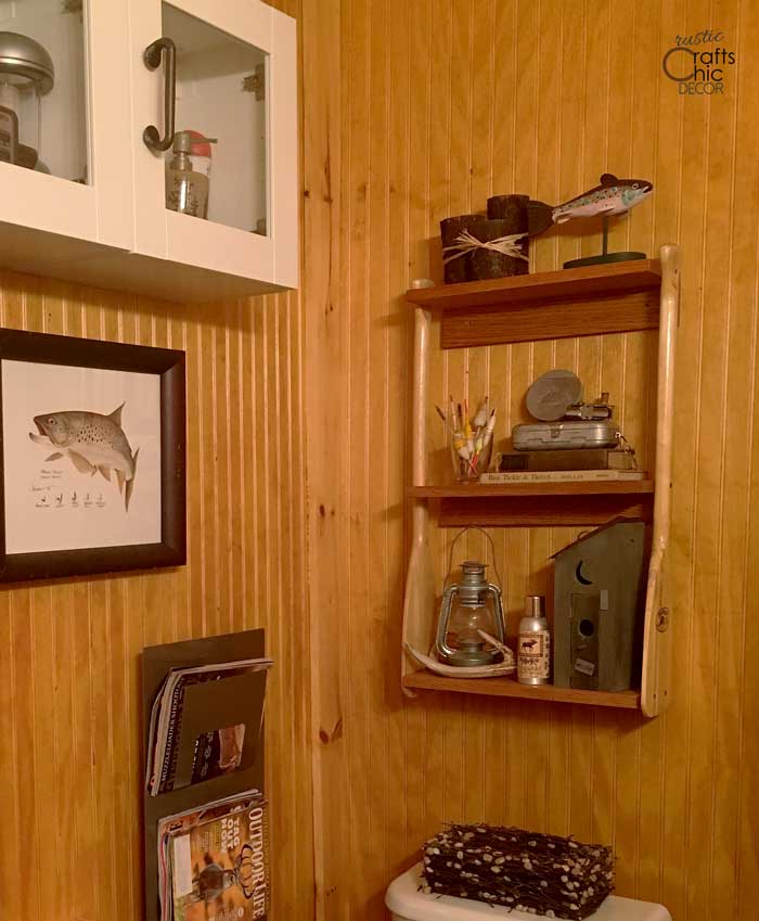 upcycled canoe paddle shelving unit