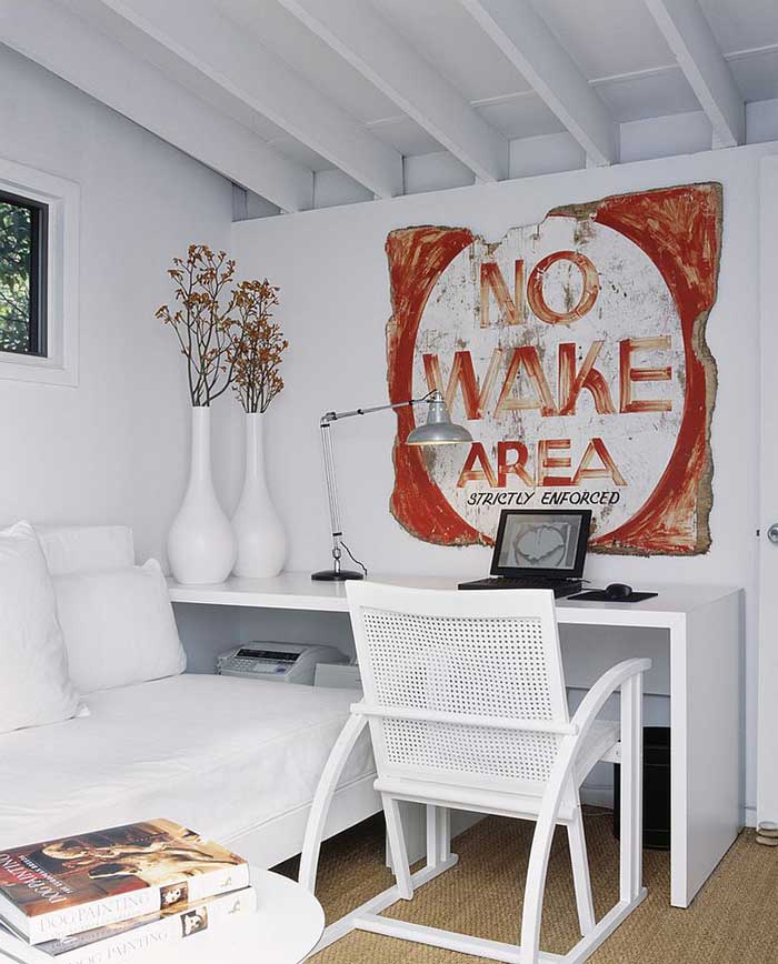 white office with distressed wood sign