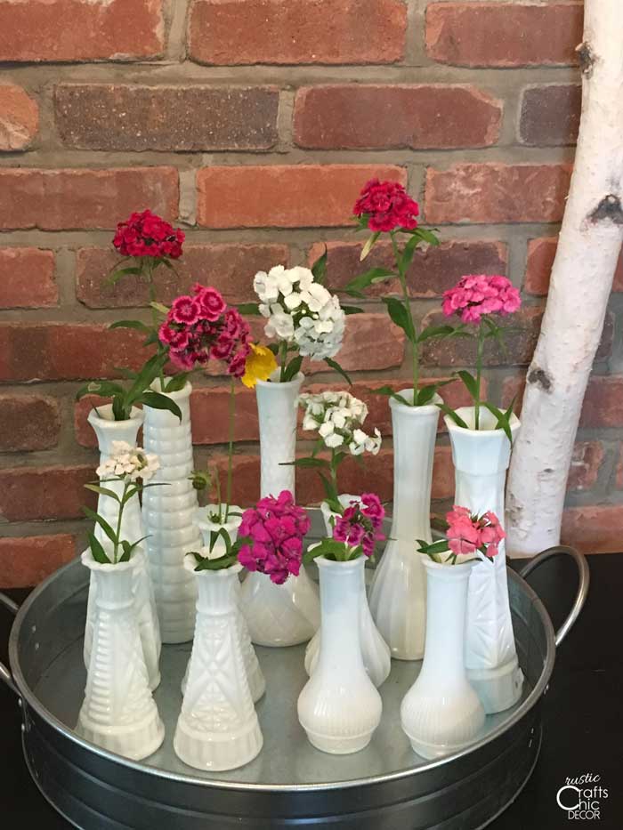 milk glass vases with wildflowers