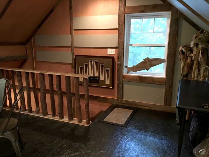 rustic 2 story garage stairway