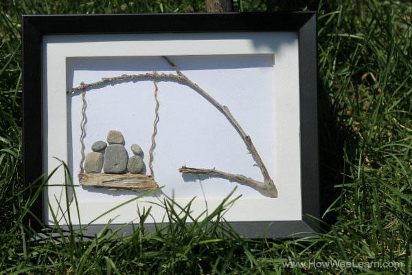 three on a swing pebble art