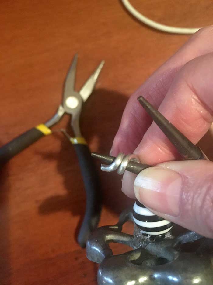 twisting wire around pliers