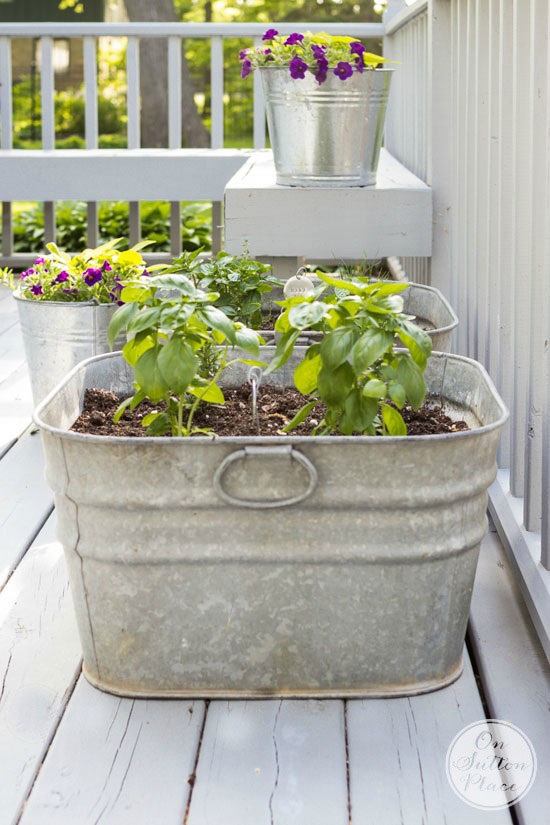 deck decorating with galvanized planters