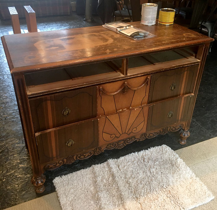 Old dresser deals into bar