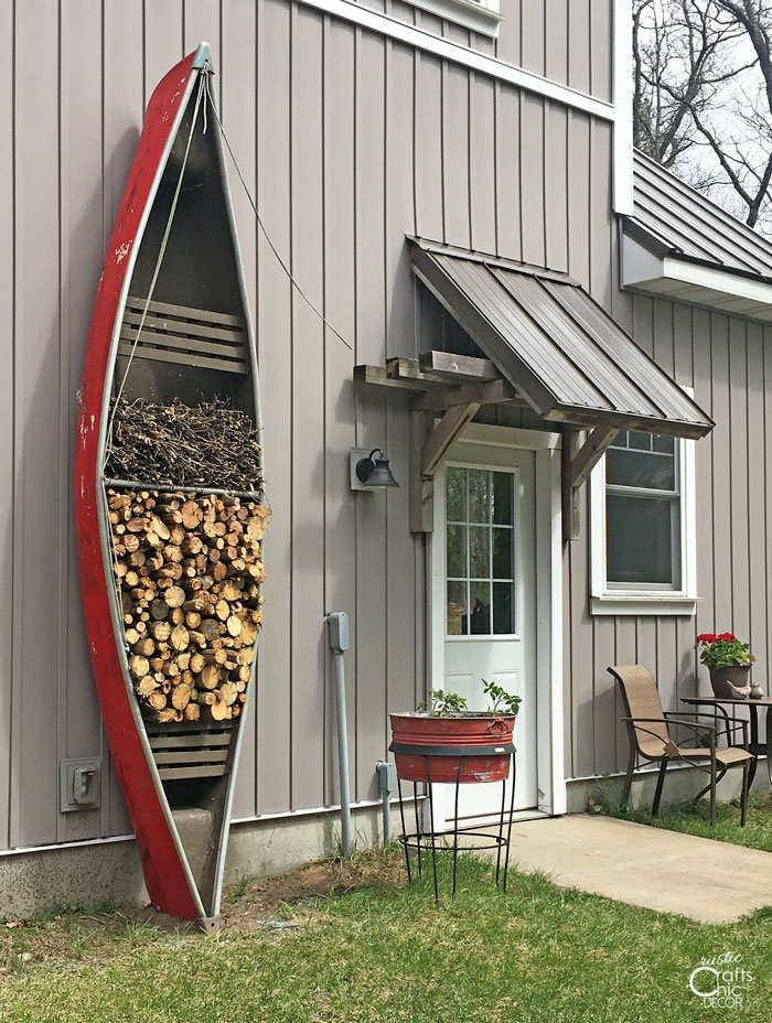 creative firewood storage in a canoe