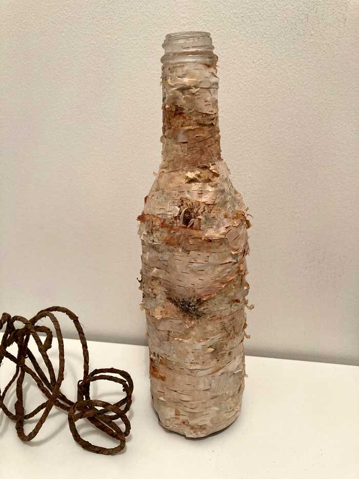 bottle covered with bark