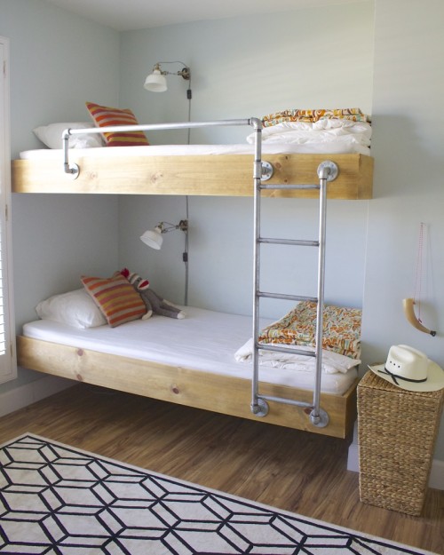 bunks with industrial pipe ladder