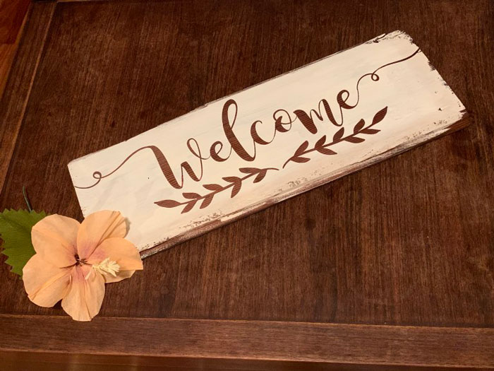 cabin welcome sign