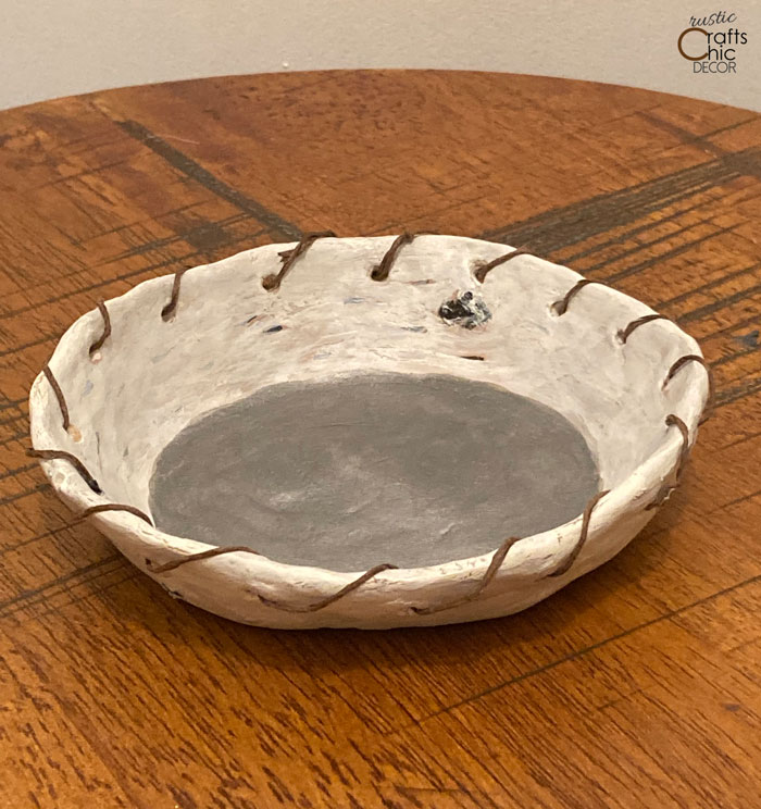 clay bowl with woven wire