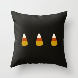 candy corn black throw pillow