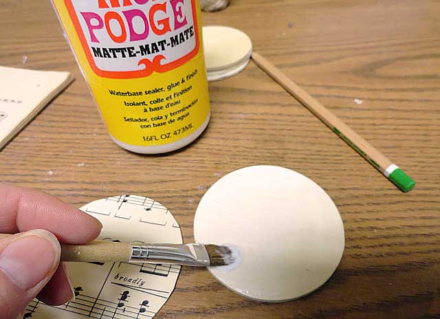 mod podge paper to wood circle